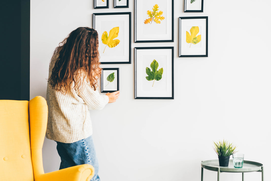 How do I arrange picture frames on a wall?